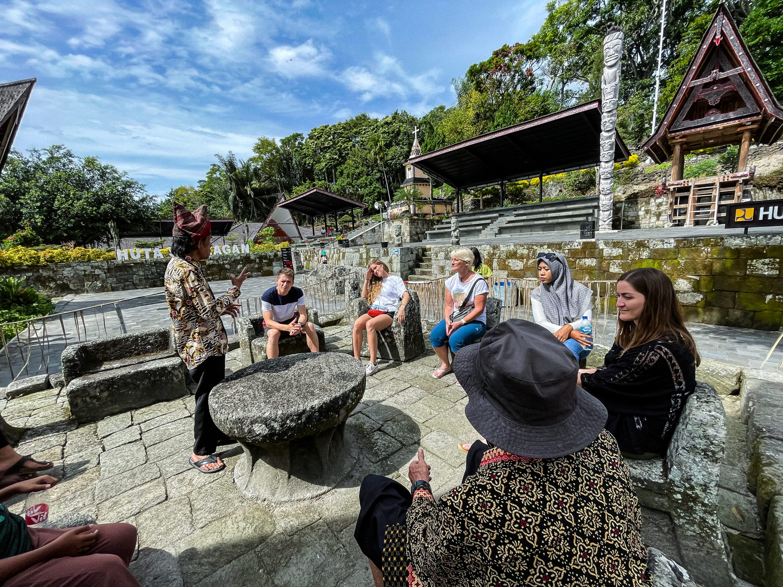 Guests learning about Batak culture during a Lake Toba journey