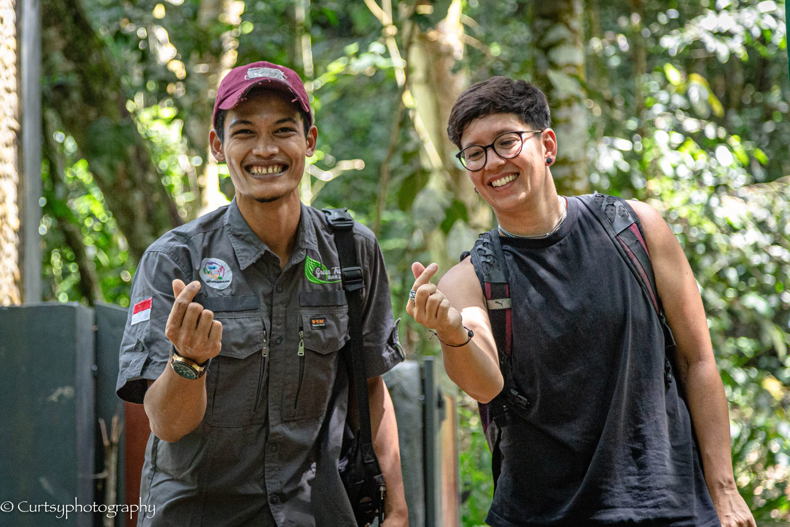 Local Bukit Lawang guide with a guest in the rainforest