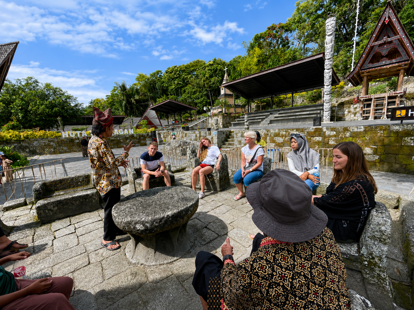 Guests learning about Batak culture with a local guide on Samosir Island